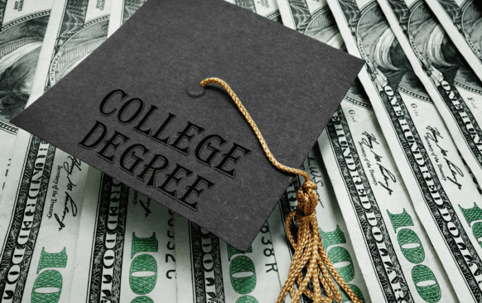 Graduation cap sitting on money