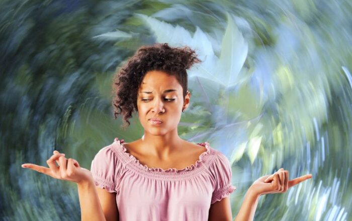 Woman trying to figure out which way the wind is blowing
