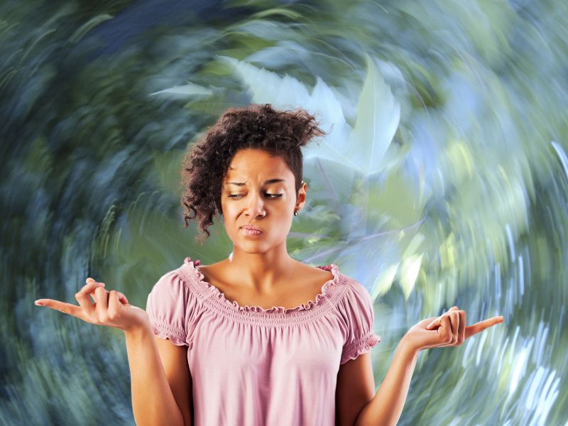 Woman trying to figure out which way the wind is blowing